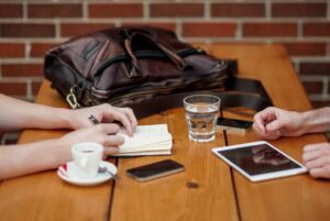 Two people sitting together and having a discussion